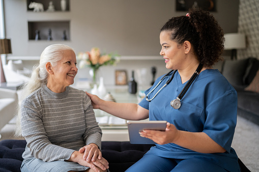 A Nurse Converses with an Elderly Woman, Promoting Healthy Motivation Tips in Jackson, TN.